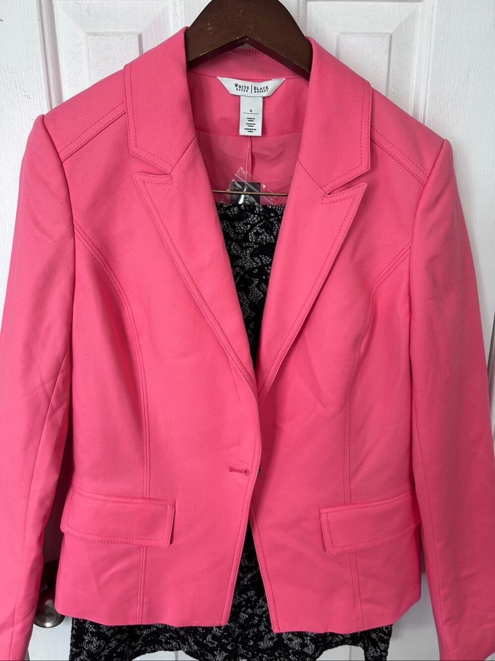 White House Black Market features a classic notch lapel and structured flap pock
